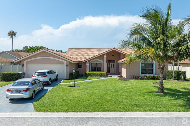 You will find some Spanish-style homes in the Cypress Creek neighborhood.