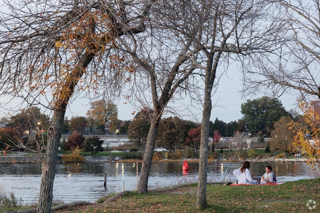 A couple makes a picnic out of a warm fall evening at Bold Point Park in East Providence, RI.