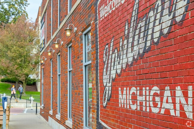 This mural on Cross Street welcomes shoppers and diners coming to Ypsi Riverside.