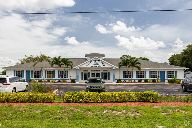 Grace Community School has a central main entrance and parking in front.