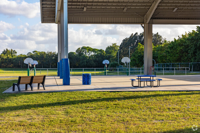 JD Parker school of technology covered sitting area and basketball courts.