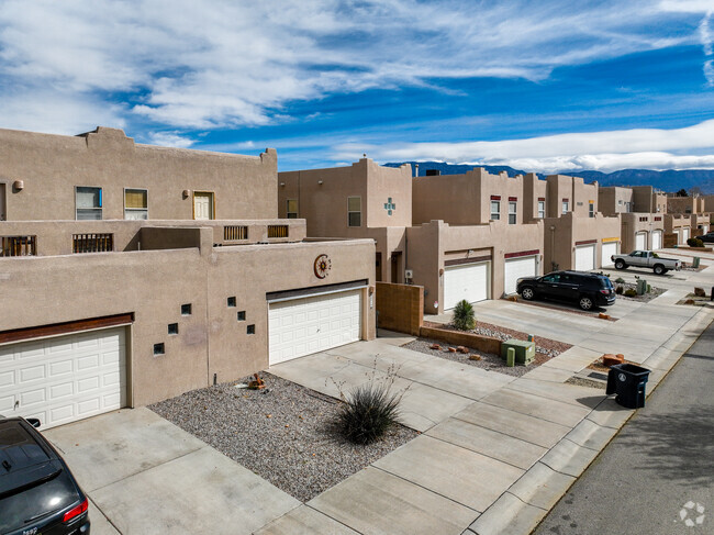 Admire the distinct two story adobe townhomes that line the streets of Hodgin, NM.