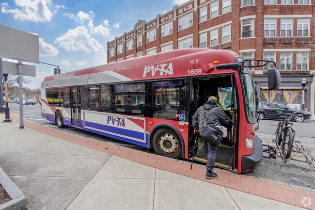 A person boards a PVTA bus in Chicopee Center.