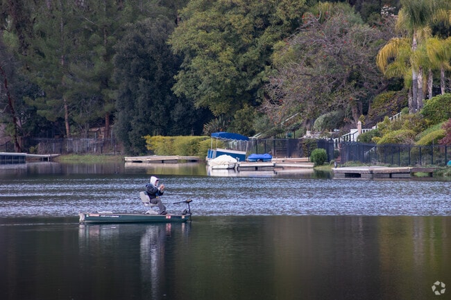 A resident fishes on a cool afternoon at Sunnymead Ranch Lake in Hidden Springs.