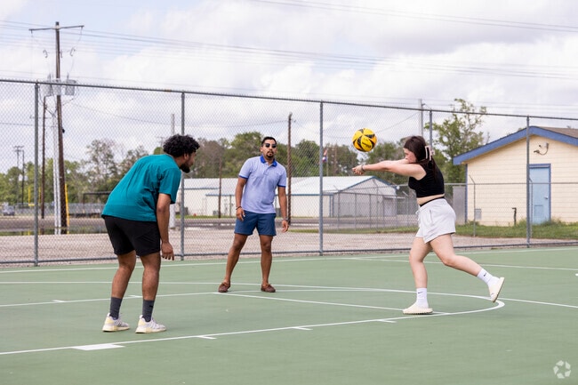 A group of friends gathers at AV Bull Sallas Park in New Caney to practice tennis.