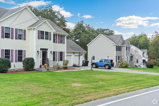 A row of colonial style homes in Ayer.