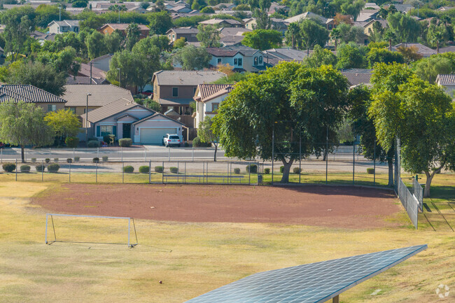 Swinging for the fences at the baseball diamond of Western Peaks Elementary School in Surprise.