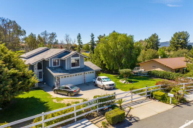Live elegantly in charming two-story Temecula homes surrounded by greenery.