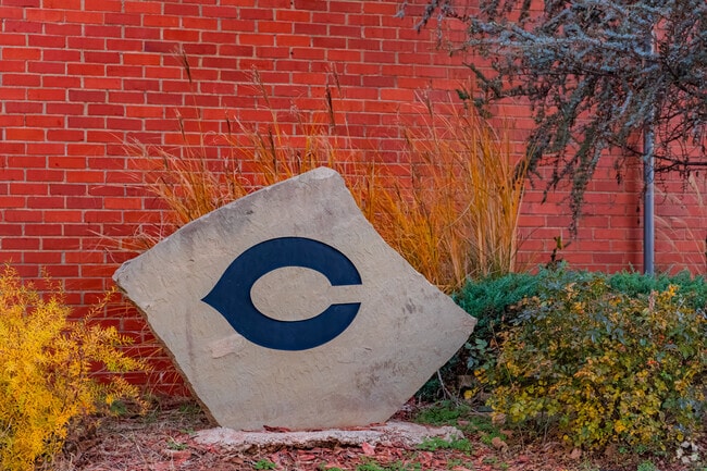 Close up shot of a stone with the symbol of Grand Avenue Elementary School