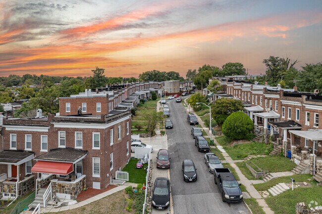 Traditional Baltimore rowhomes line the curved streets of Franklintown Road.
