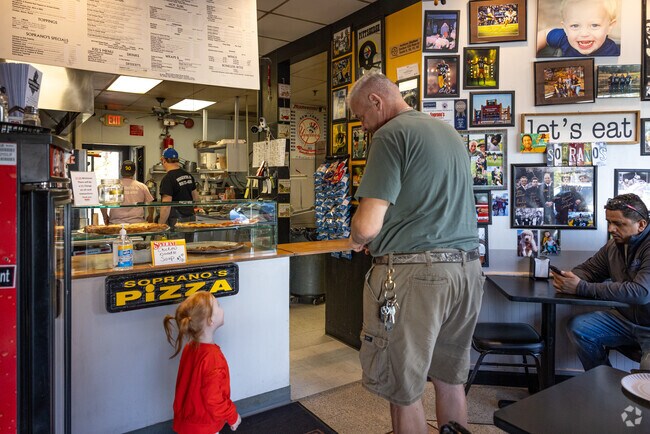 Enjoy browsing the photo wall at Soprano’s Pizzeria in Finderne whilst you wait for your pie.