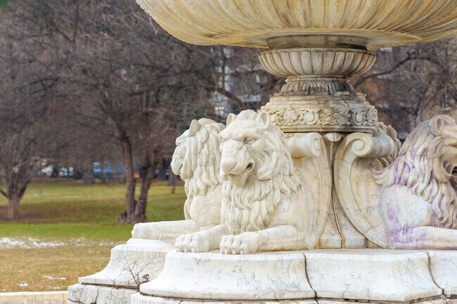 Intricately carved lion fountain adds timeless elegance to Hungarian Freedom Park.