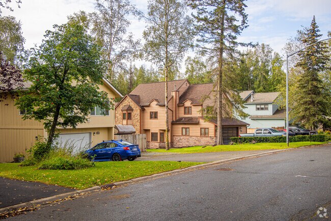 Homes in Taku/Campbell are typically surrounded by tall trees and lush lawns.