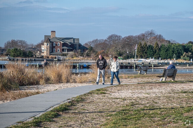 Locals enjoy a walk around the Bay Shore Marina at the end of South Clinton Avenue.