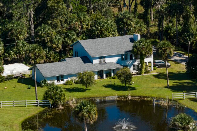 This 2-story ranch home with its own pond can be found near Lake George in Seville, Florida.