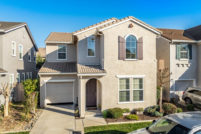 This Mediterranean home has stucco siding and a tile roof in Capital Village.