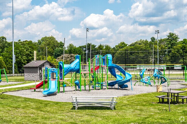 Ritter Field Playground in Waterford Township offers play areas near sports courts.
