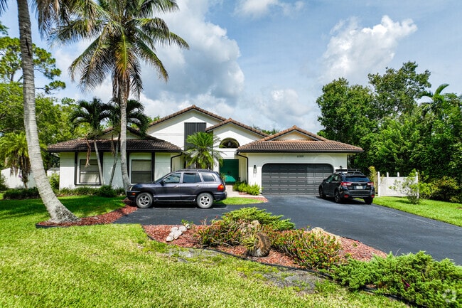 A home in Pinetree Estates, Parkland, Florida, features multiple roofing styles.