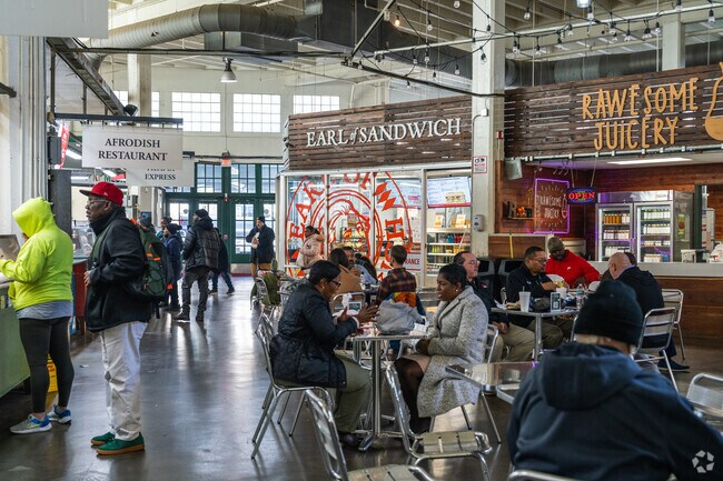 Many Vine City residents frequent the food court of Municipal Market for a variety of cuisine.