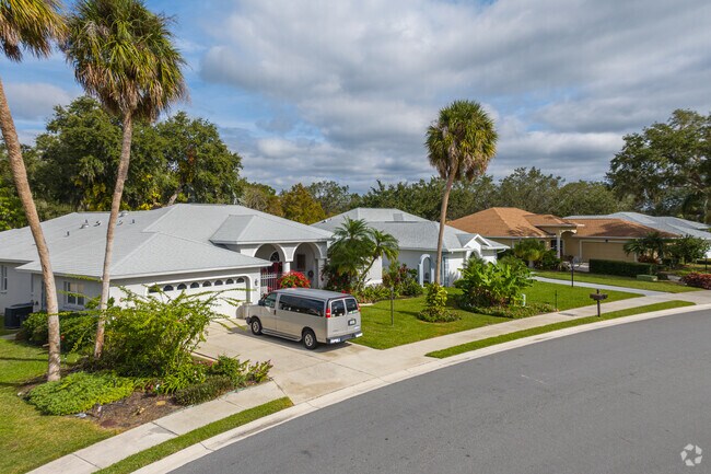 A row of homes combining modern convenience Mediterranean arches.