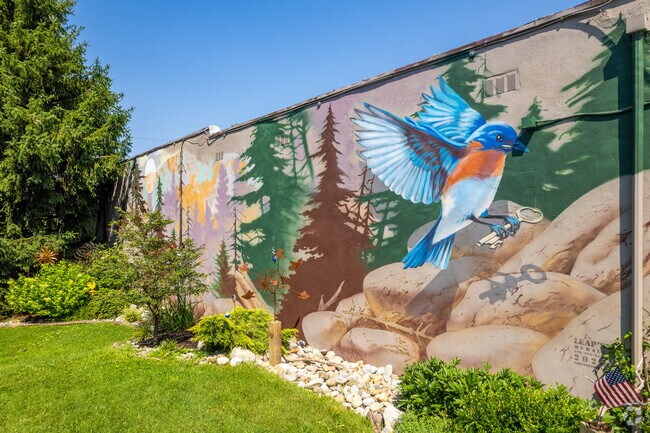 A nature inspired mural alongside a shop brings life to the main shopping area in Runnemede.