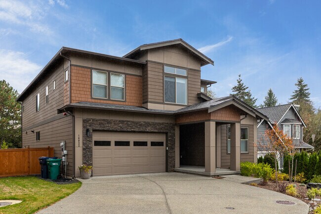 Contemporary geometric homes appear in West Ridge developments.