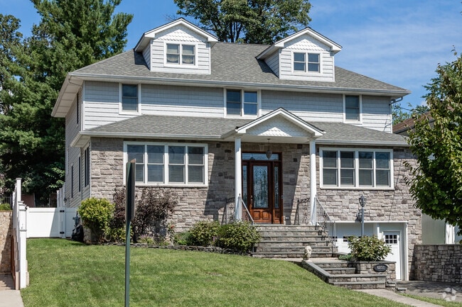 A Stone-front house with shingles in Pleasant Plains.