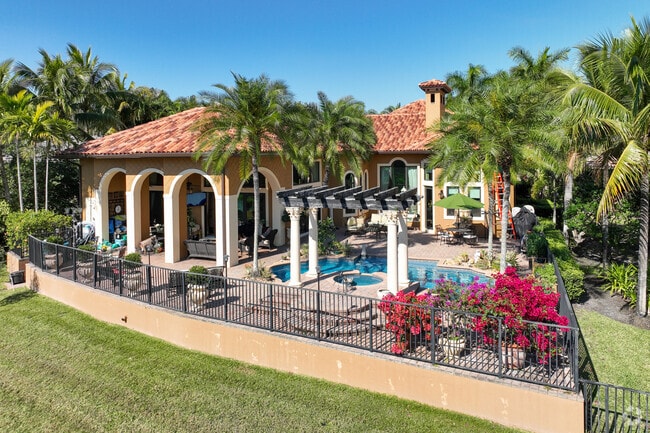 Spanish-style home with pool in Heron Bay.