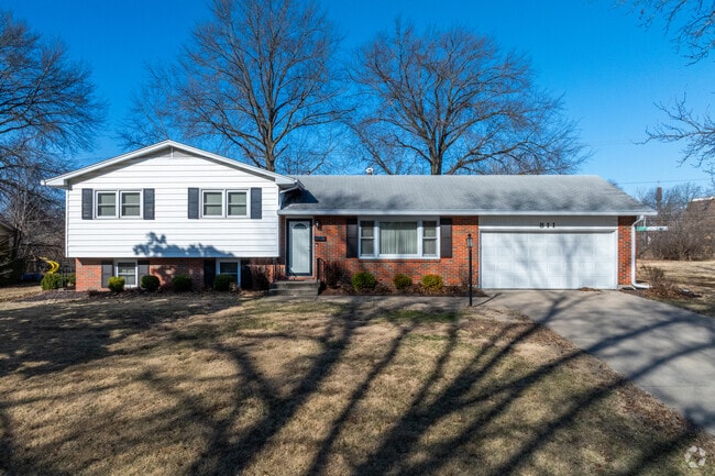 Homes in College Park are shaded by large oaks that line the streets and backyards.