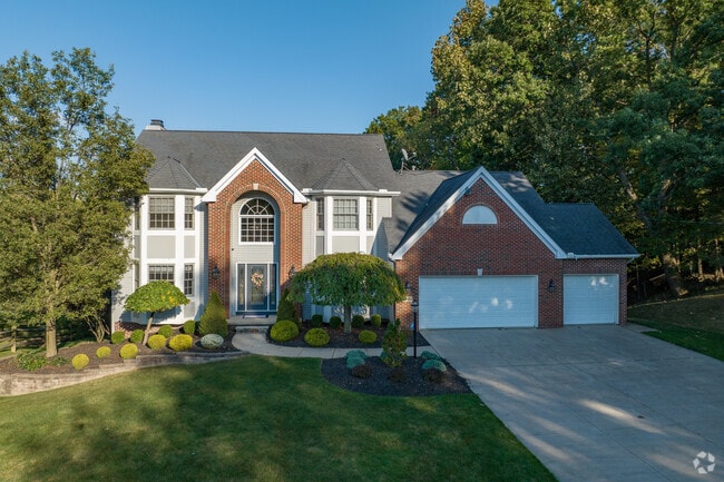Colonial style homes in Seven Hills can be found on secluded wooded lots.