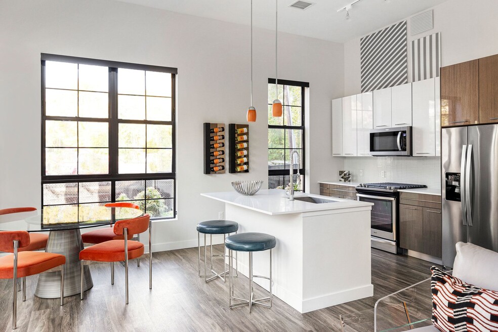 The chef-inspired kitchens feature gas stoves, stainless steel appliances and quartz countertops