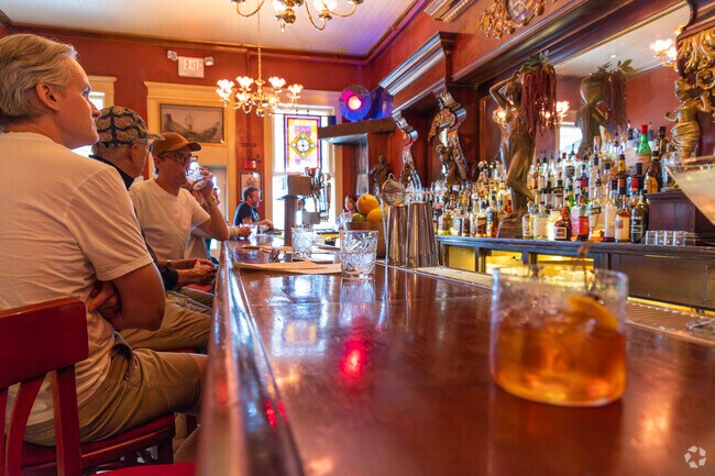 Friends and travelers gather at the bar at The Legal Tender Saloon in Lamy.