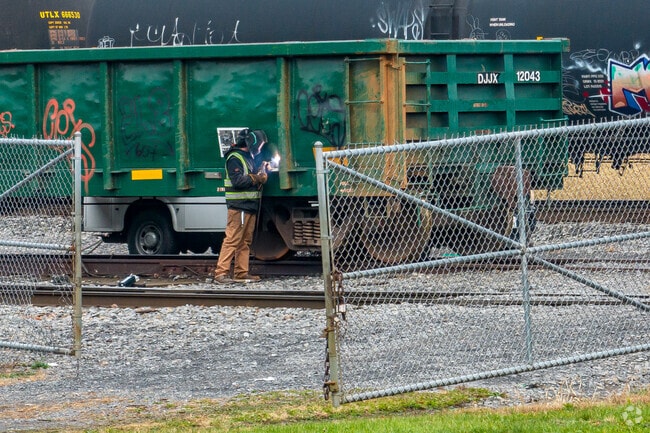 Train welding in Park Ave showcases skilled labor and industrial work in Syracuse.