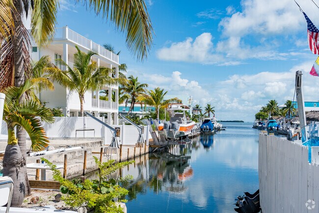 Embraced by lush tropical foliage and serene waters at your front door, Duck Key offers the essence of island living.