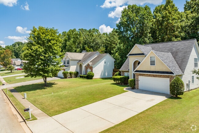 Newer homes with fresh lawns are scattered around Stockbridge.