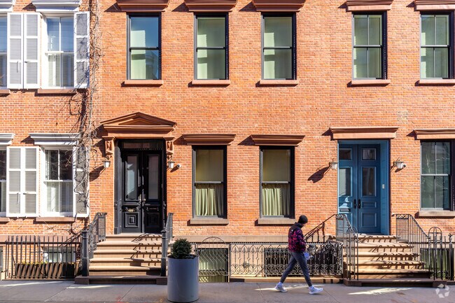 Rows of red brick townhouses are commonly seen throughout West Village's smaller streets.