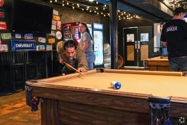 A person hits the cue ball while playing pool at Big Daddy's Honky Tonk near Bradford-Ridgewood.