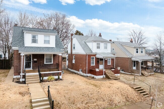 Brick cottages with a double dormer are nestled together in Clayton-Tamm.