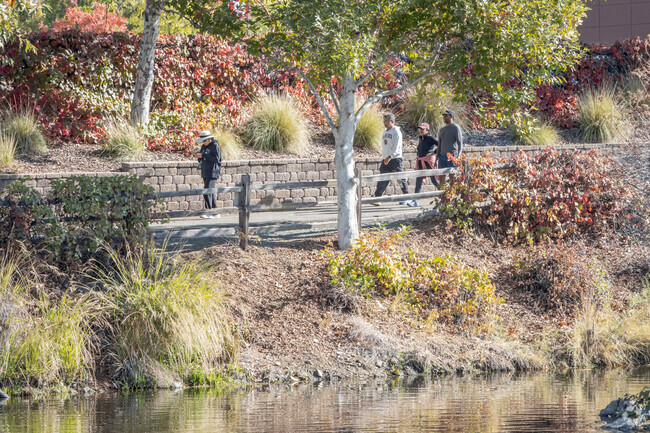Many walk the paths on the waterfront at El Dorado Town Center for exercise.