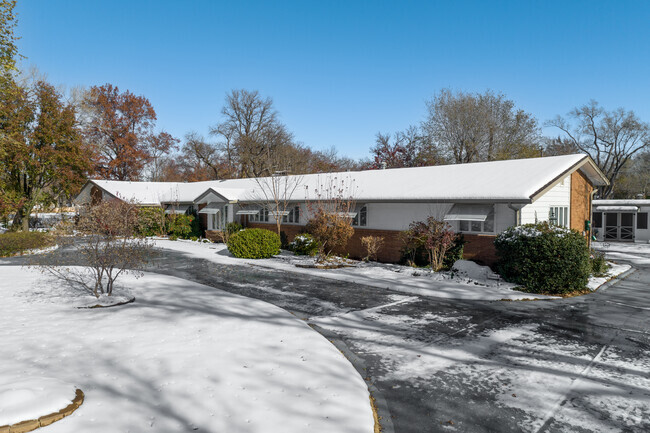 This Forest Hills home has a large circle drive.