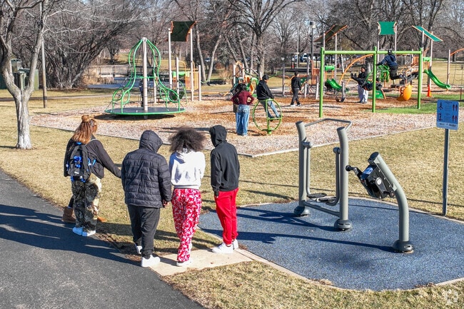 Local kids gathering at the Centennial Park playground.