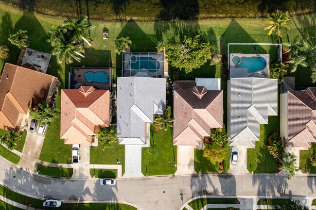 A look down at colorful rooftops & swimming pools in the Lake Charleston neighborhood.