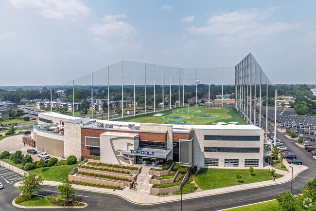 TopGolf Brooklyn Center offers year-round entertainment with climate-controlled hitting bays, where guests enjoy interactive golf games, food, and drinks in a fun social atmosphere perfect for all skill levels.