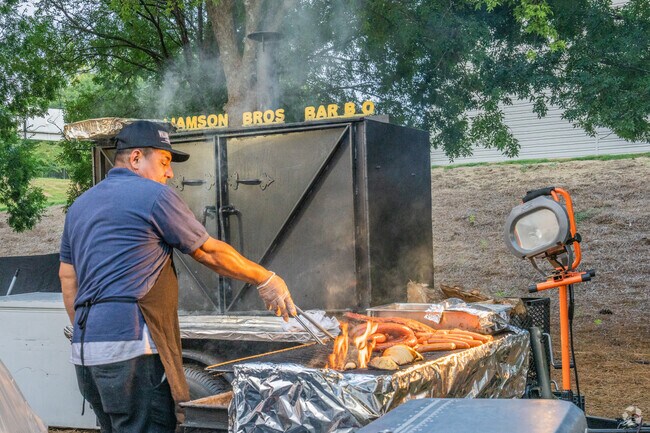 Restaurants and business compete at the Pigs and Peaches BBQ Festival in Kennesaw.