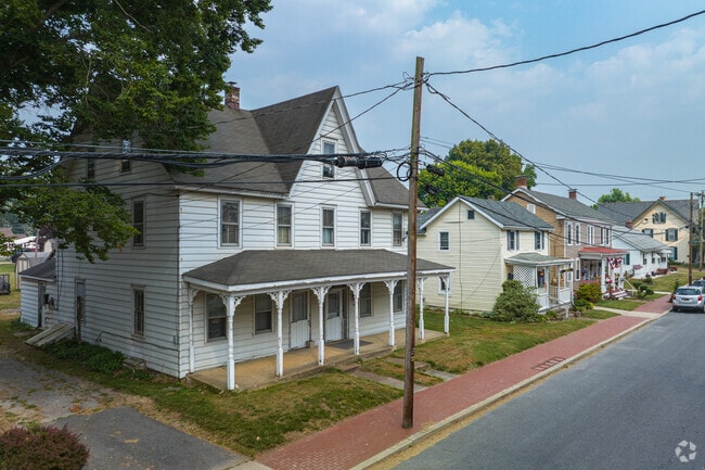 N Main St in St. Georges features a row of historic Colonial homes.