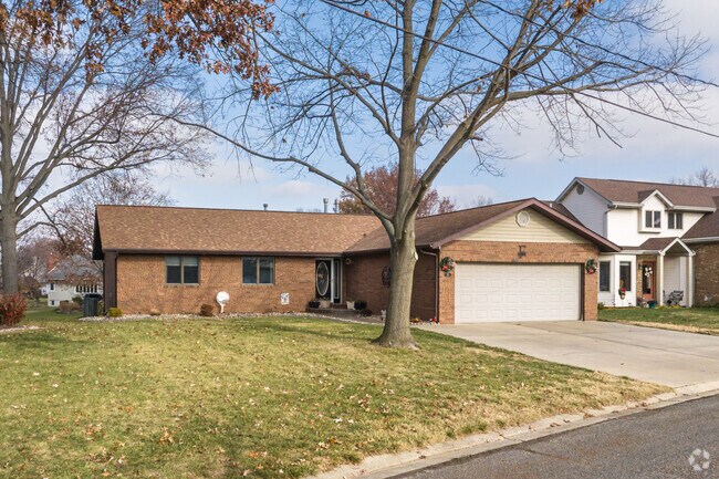 This brick ranch has large yard Highland.