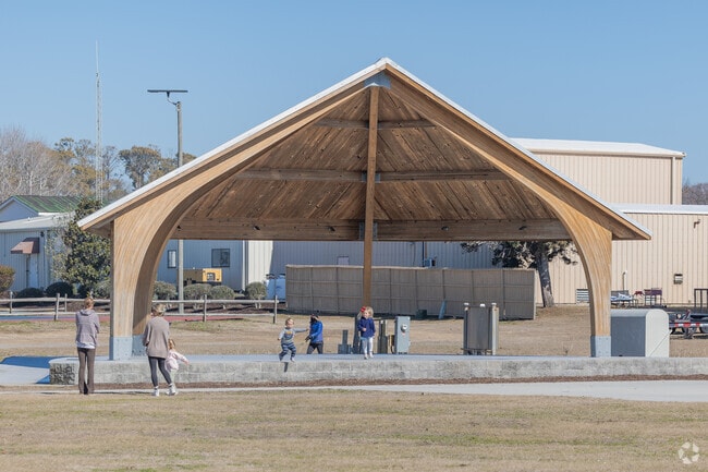 Families love to gather to chat, play, and watch concerts at the Middleton Park Complex Amphitheater in Oak Island.