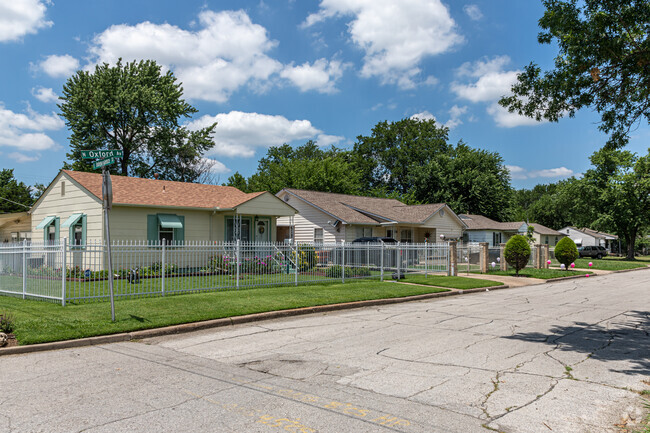 Some yards in the Maplewood neighborhood are enclosed by fences.