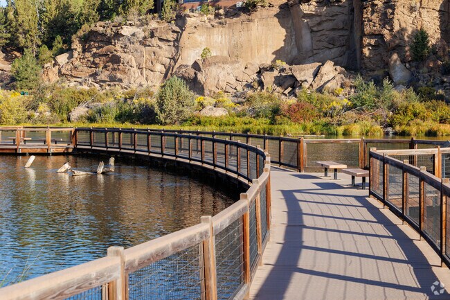 You walk over the river on the curved walkway at Farewell Bend Park.