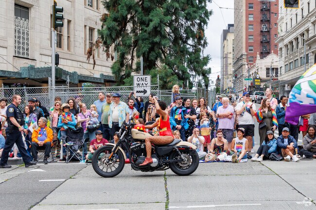Rainbow flags and joyful faces fill Downtown Seattle during the annual Pride Parade.